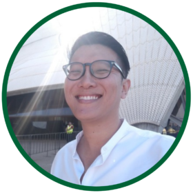 President Gabriel Kwek wears a pair of black spectacles frame, and he smiles brightly against the backdrop of sun beams shining on the the Sydney Opera House.